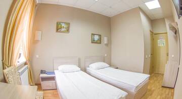 Стандартный двухместный номер с 2 отдельными кроватями в Гостинице Уют